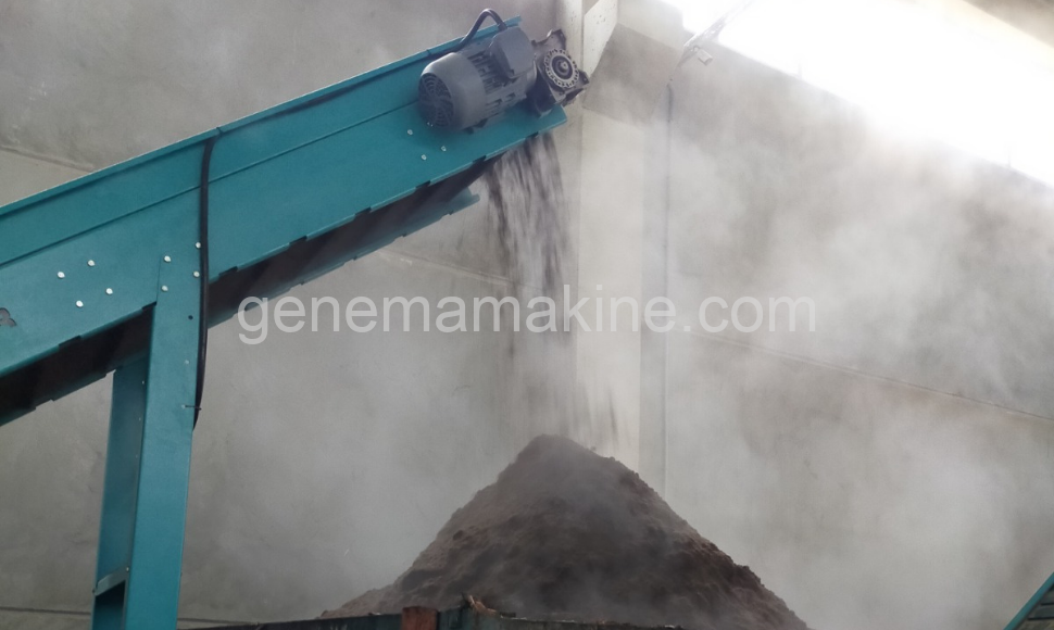 The compost conveyor transfers processed organic material and releases it as mature, soil-ready compost, ensuring a clean, controlled and efficient discharge stage in the composting process. Compost conveyor discharging processed organic waste as finished compost